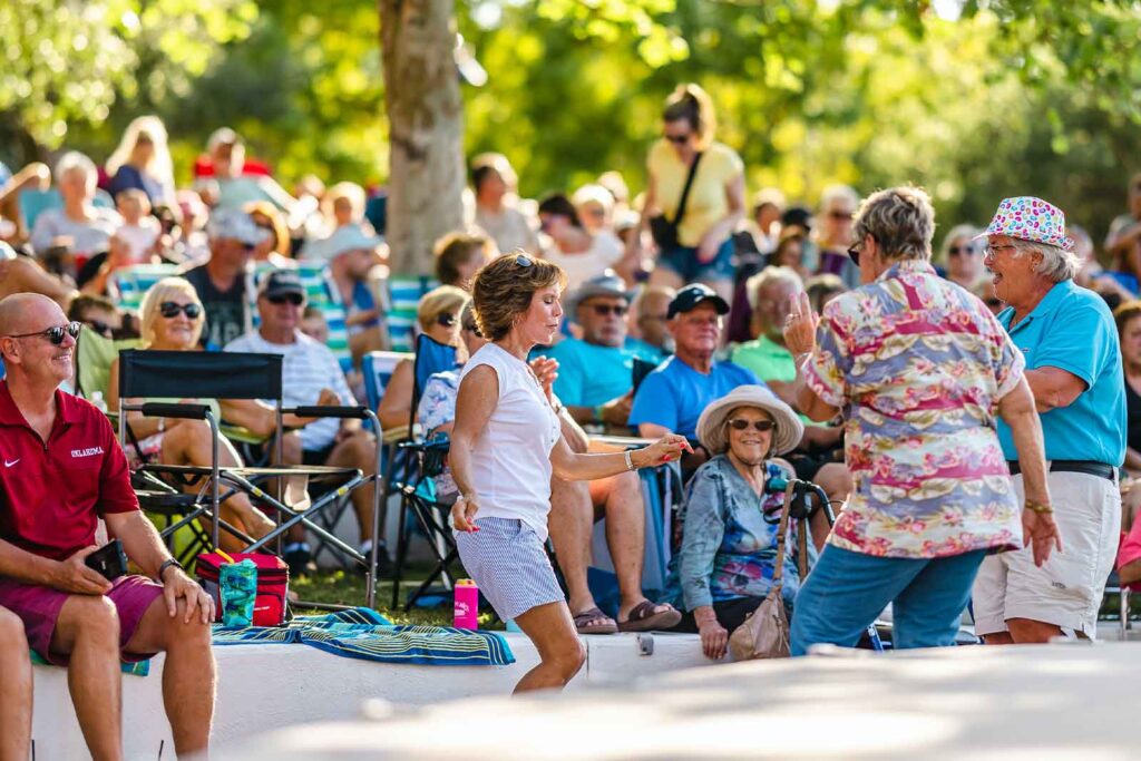people dancing at music in the park event