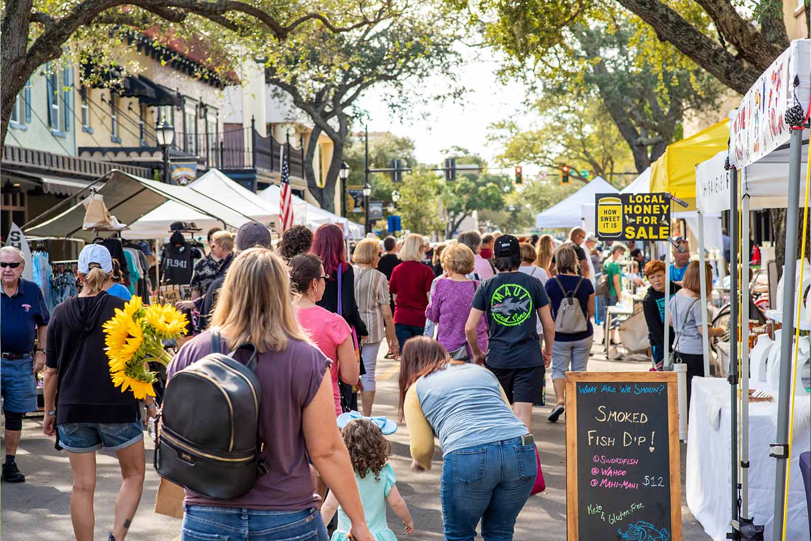 crowd of people at the bradenton market